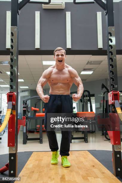 furious sportsman showing muscles - angry bodybuilders posing stock pictures, royalty-free photos & images