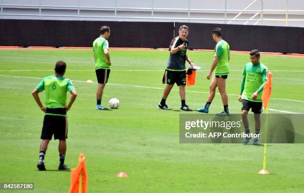 Mexico's coach Juan Carlos Osorio gives instructions to his players during a training at the National Stadium in San Jose on September 4, 2017 ahead...