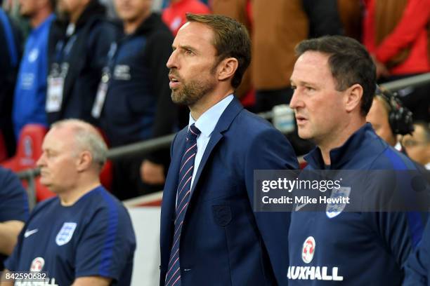 Gareth Southgate manager of England and Steve Holland assistant manager of England look on prior to the FIFA 2018 World Cup Qualifier between England...