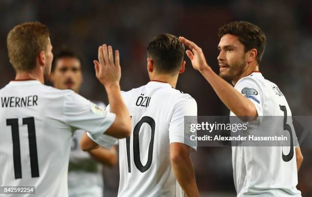 Mesut Oezil of Germany is celebrated by Jonas Hector of Germany and Timo Werner of Germany after he scored Germany's first goal. During the FIFA 2018...