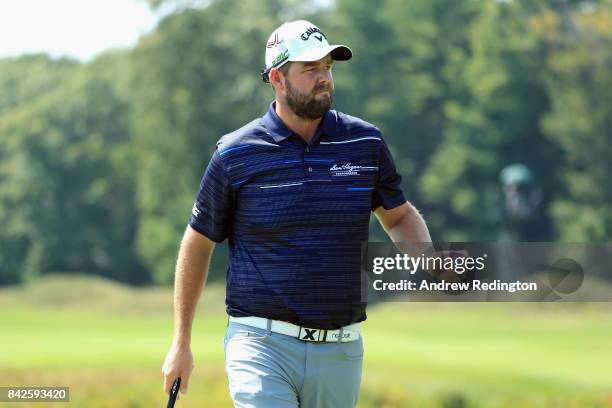 Marc Leishman of Australia acknowledges fans after putting on the second green during the final round of the Dell Technologies Championship at TPC...