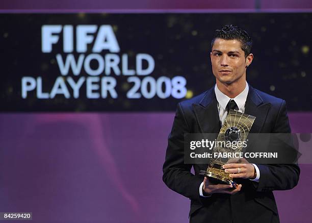 Portuguese football player Cristiano Ronaldo poses with FIFA world footballer of the year 2008 award during a ceremony on January 12, 2009 in Zurich....