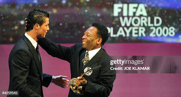 Portuguese football player Cristiano Ronaldo is congratulated by Brazilian football legend Pele after recieving the FIFA world footballer of the year...