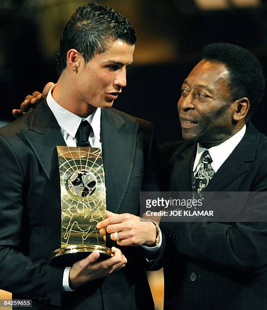 Portuguese football player Cristiano Ronaldo is congratulated by Brazilian football legend Pele after recieving the FIFA world footballer of the year...