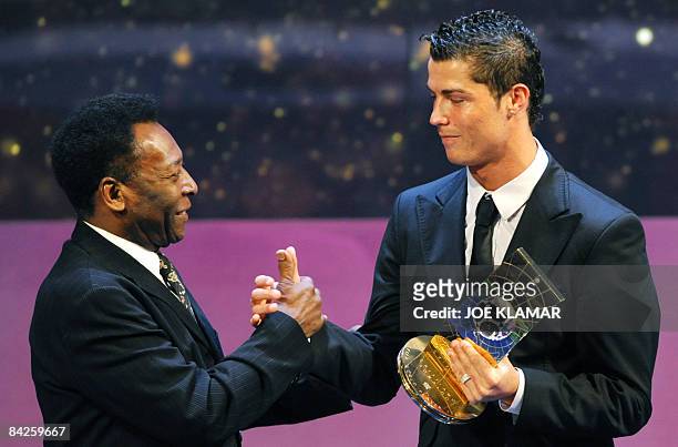 Portuguese football player Cristiano Ronaldo is congratulated by Brazilian football legend Pele after recieving the FIFA world footballer of the year...