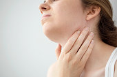 Young woman feeling painful in the throat
