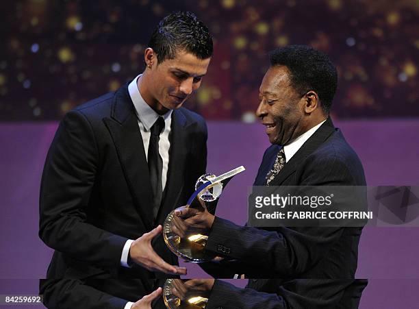 Portuguese football player Cristiano Ronaldo receives from the hands of Brazilian football legend Pele the FIFA world footballer of the year 2008...