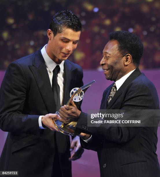 Portuguese football player Cristiano Ronaldo receives from the hands of Brazilian football legend Pele the FIFA world footballer of the year 2008...