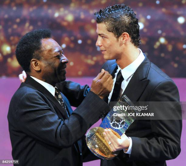 Portuguese football player Cristiano Ronaldo is congratulated by Brazilian football legend Pele after recieving the FIFA world footballer of the year...