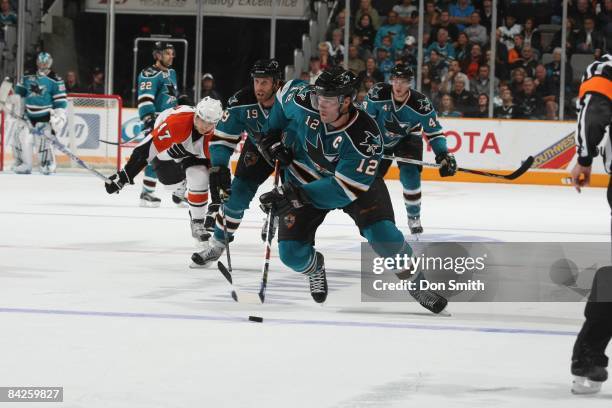 Patrick Marleau of the San Jose Sharks moves the puck up ice during an NHL game against the Philadelphia Flyers on October 18, 2008 at HP Pavilion at...