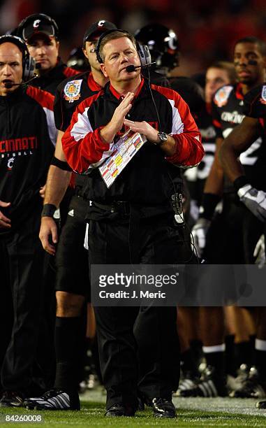 Head coach Brian Kelly of the Cincinnati Bearcats calls time out against the Virginia Tech Hokies during the FedEx Orange Bowl at Dolphin Stadium on...