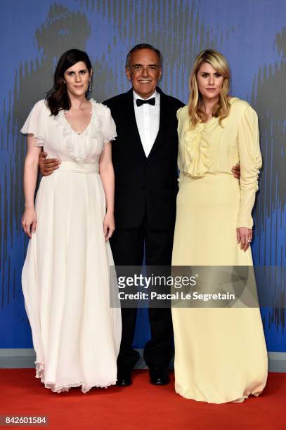 Laura Mulleavy, festival director Alberto Barbera and Kate Mulleavy walks the red carpet ahead of the 'Woodshock' screening during the 74th Venice...