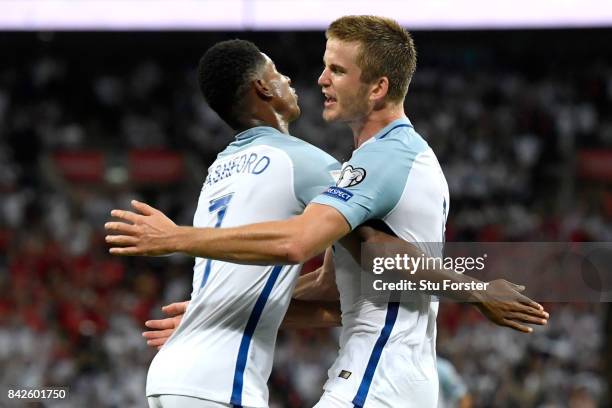 Eric Dier of England celebrates as he scores their first goal with Marcus Rashford of England during the FIFA 2018 World Cup Qualifier between...