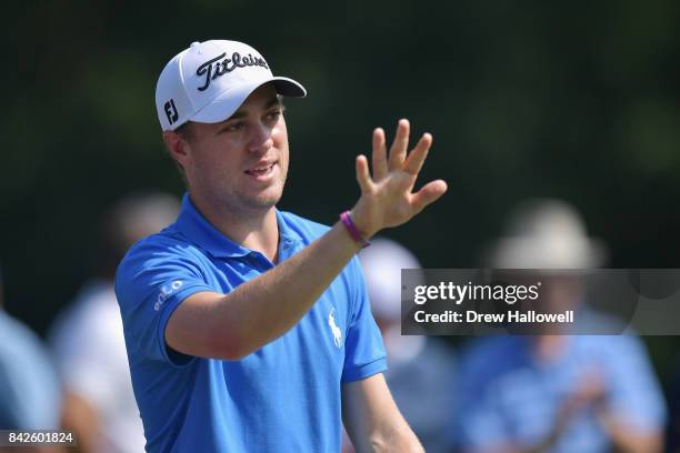 Justin Thomas of the United States waves to fans after playing his shot from the fourth tee during the final round of the Dell Technologies...