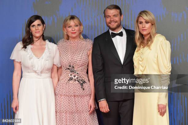 Laura Mulleavy, Pilou Asbaek, Kirsten Dunst and Kate Mulleavy walk the red carpet ahead of the 'Woodshock' screening during the 74th Venice Film...