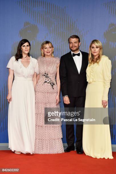 Laura Mulleavy, Pilou Asbaek, Kirsten Dunst and Kate Mulleavy walk the red carpet ahead of the 'Woodshock' screening during the 74th Venice Film...