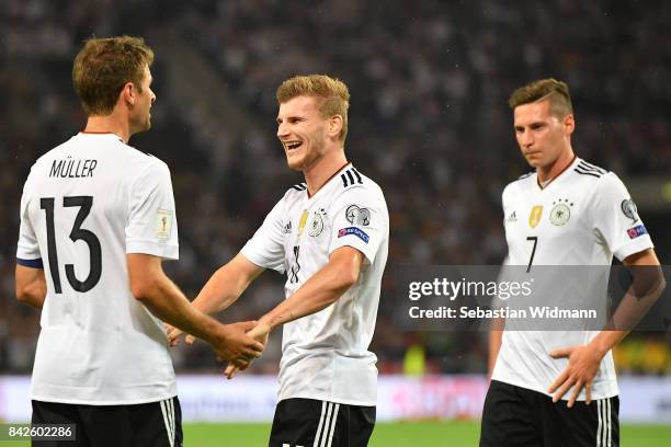 Timo Werner of Germany celeberates with Julian Draxler of Germany and Thomas Mueller of Germany after he scored to make it 4:0 during the FIFA 2018...