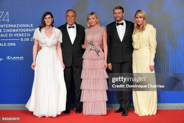 Laura Mulleavy, festival director Alberto Barbera, Kirsten Dunst, Pilou Asbaek and Kate Mulleavy walk the red carpet ahead of the 'Woodshock'...