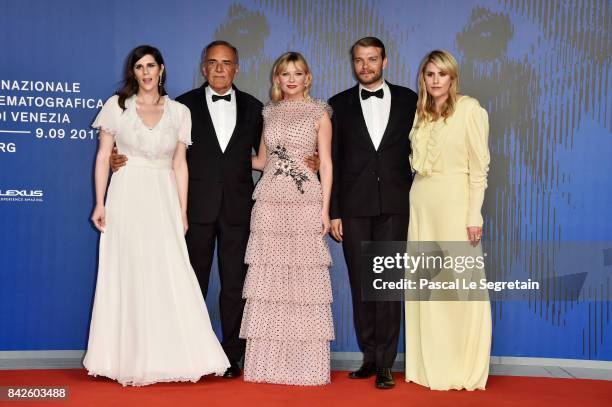 Laura Mulleavy, festival director Alberto Barbera, Kirsten Dunst, Pilou Asbaek and Kate Mulleavy walk the red carpet ahead of the 'Woodshock'...