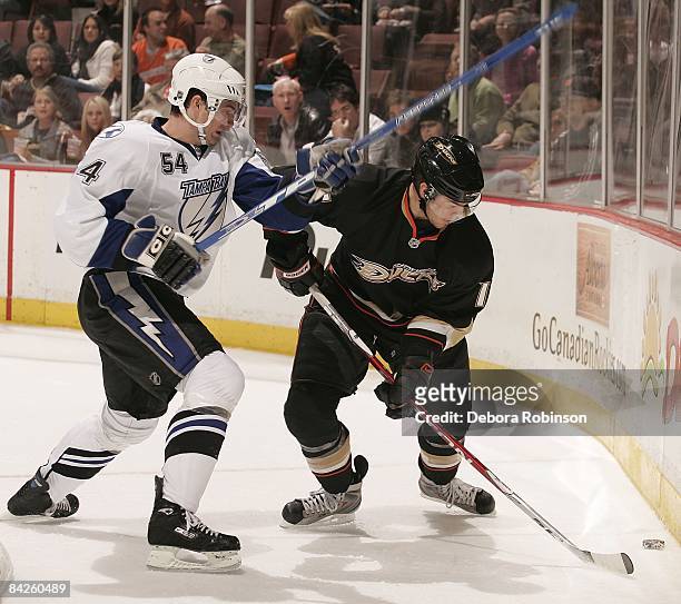 Paul Ranger of the Tampa Bay Lighting battles for the puck behind the net against Ryan Getzlaf of the Anaheim Ducks during the game on January 9,...