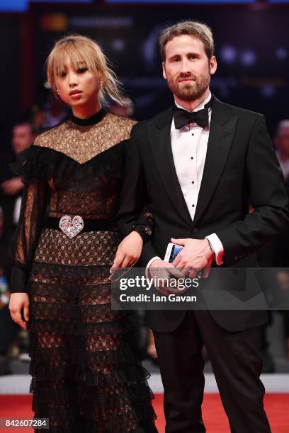 Margaret Zhang Margaret Zhang wearing a Jaeger-LeCoultre and a guest walk the red carpet ahead of the 'Three Billboards Outside Ebbing, Missouri'...