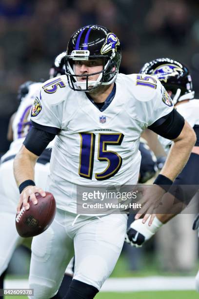 Ryan Mallett of the Baltimore Ravens scrambles to avoid the rush during a preseason game against the New Orleans Saints at Mercedes-Benz Superdome on...