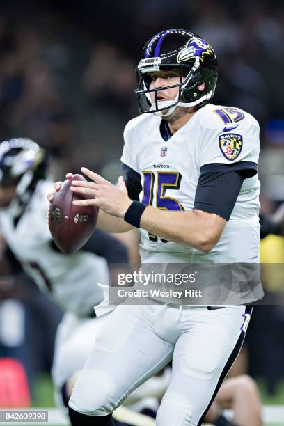 Ryan Mallett of the Baltimore Ravens scrambles to avoid the rush during a preseason game against the New Orleans Saints at Mercedes-Benz Superdome on...