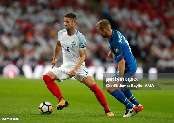 Gary Cahill of England and Tomas Hubocan of Slovakia during the FIFA 2018 World Cup Qualifier between England and Slovakia at Wembley Stadium on...