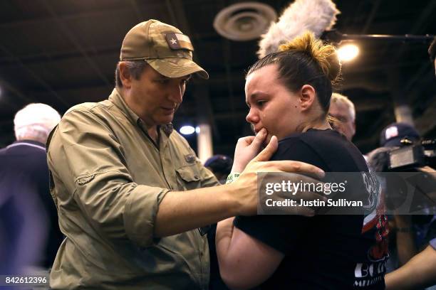 Sen. Ted Cruz comforts Hurricane Harvey evacuee Jennifer Nixon as she cries at the NRG Center evacuation center on September 4, 2017 in Houston,...