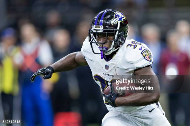 Bobby Rainey of the Baltimore Ravens runs the ball during a preseason game against the New Orleans Saints at Mercedes-Benz Superdome on August 31,...