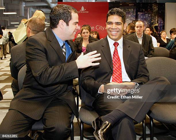 Lon Plotkin and Jesus Aguilar share a laugh as they wait to be called for application reviews at CityCenter's new career center January 12, 2009 in...