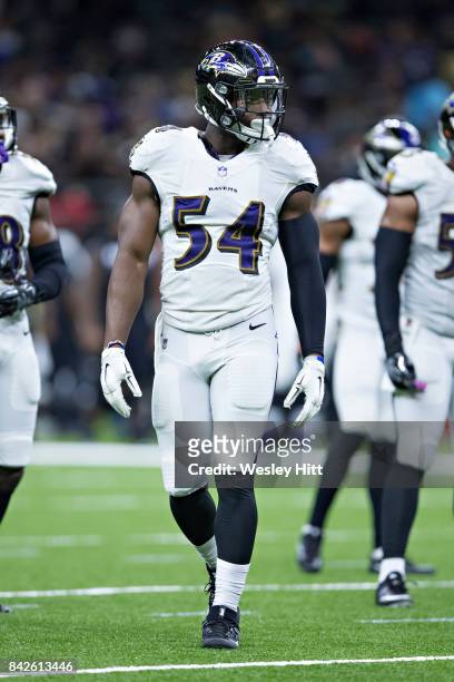 Tyus Bowser of the Baltimore Ravens looks over the offense during a preseason game against the New Orleans Saints at Mercedes-Benz Superdome on...