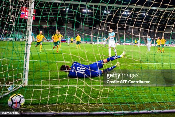 Lithuania's goalkeeper Ernestas Setkus fails to catch a second penalty scored by Slovenia's Josip Ilicic during the FIFA World Cup 2018 qualification...