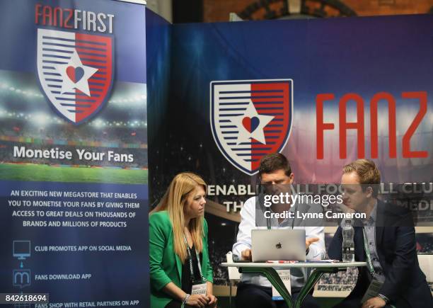 Niall Quinn talks to exhibitors on the Fanz First stand during day 1 of the Soccerex Global Convention at Manchester Central Convention Complex on...