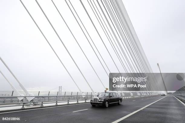 Queen Elizabeth II and Prince Philip, Duke of Edinburgh are driven across the bridge during the official opening of the Queensferry Crossing on...