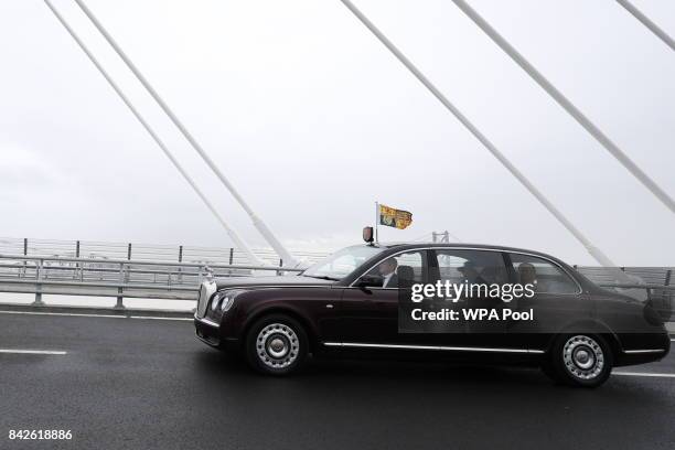 Queen Elizabeth II and Prince Philip, Duke of Edinburgh are driven across the bridge during the official opening of the Queensferry Crossing on...