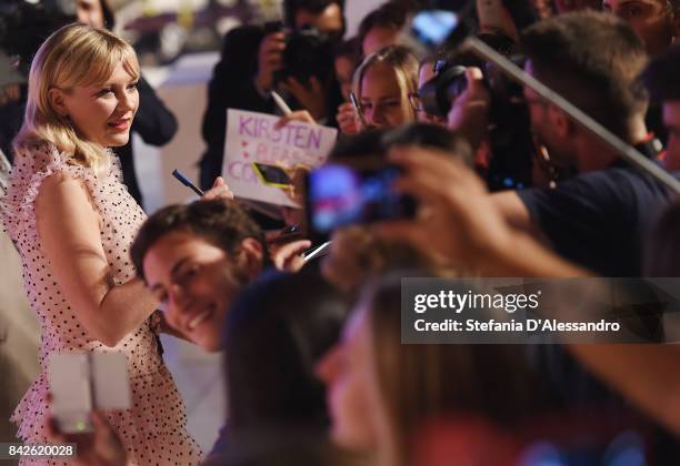 Kirsten Dunst from the movie 'Woodshock' signs autographs during the red carpet ahead of the 'Three Billboards Outside Ebbing, Missouri' screening...