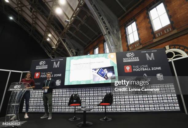 Peter Legters of KNVB talks with Tessel Middag of the Netherlands and Manchester City during day 1 of the Soccerex Global Convention at Manchester...