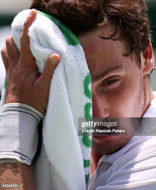 Ernests Gulbis of Latvia takes a break during his first round match against Marcel Granollers of Spain during day two of the Heineken Open at ASB...