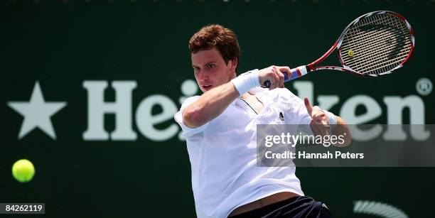 Ernests Gulbis of Latvia plays a forehand during his first round match against Marcel Granollers of Spain during day two of the Heineken Open at ASB...