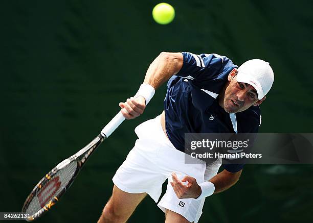Oscar Hernandez of Spain serves during his first round match against Bobby Reynolds of the USA during day two of the Heineken Open at ASB Tennis...