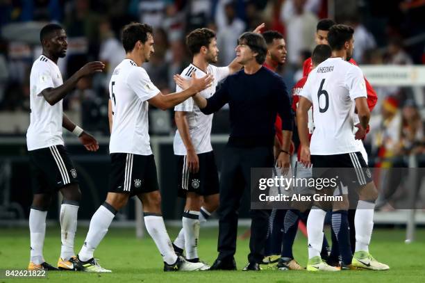 Head coach Joachim Loew of Germany celebrates with his players after winning the FIFA 2018 World Cup Qualifier between Germany and Norway at...
