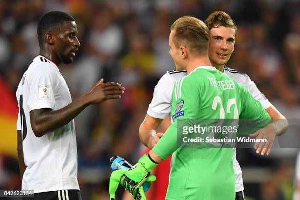 Antonio Ruediger of Germany Marc-Andre ter Stegen of Germany and Leon Goretzka of Germany embrace after the FIFA 2018 World Cup Qualifier between...