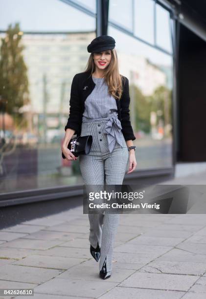 Alexandra Lapp wearing grey checked top and checked high waist pants by Zara, flat cap hat from Chanel, Tweed little black jacket in black from...