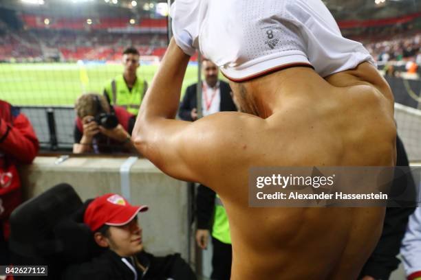 Sami Khedira of Germany gives his shirt to a disabled fan after the FIFA 2018 World Cup Qualifier between Germany and Norway at Mercedes-Benz Arena...