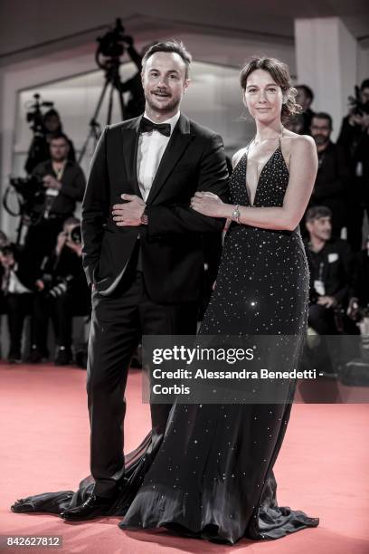 Nicolas Sirie and Cristiana Capotondi walk the red carpet ahead of the 'Three Billboards Outside Ebbing, Missouri' screening during the 74th Venice...