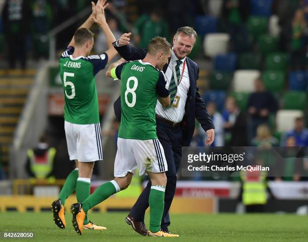 Northern Ireland manager Michael O'Neill celebrates with Steve Davis after the FIFA 2018 World Cup Qualifier between Northern Ireland and Czech...