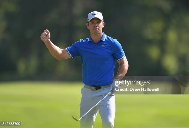 Paul Casey of England reacts after hitting the flag shaft on the seventh green during the final round of the Dell Technologies Championship at TPC...
