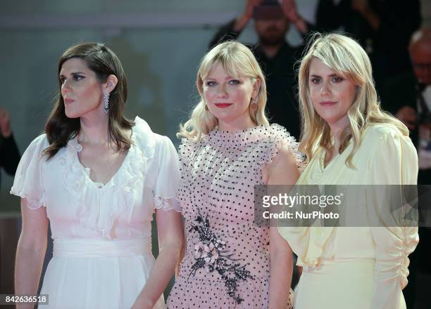 Kate Mulleavy, Kirsten Dunst and Laura Mulleavy walk the red carpet ahead of the 'Woodshock' screening during the 74th Venice Film Festival in...