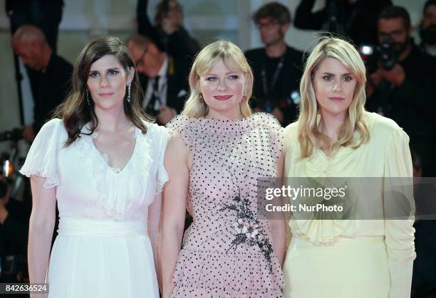 Kate Mulleavy, Kirsten Dunst and Laura Mulleavy walk the red carpet ahead of the 'Woodshock' screening during the 74th Venice Film Festival in...